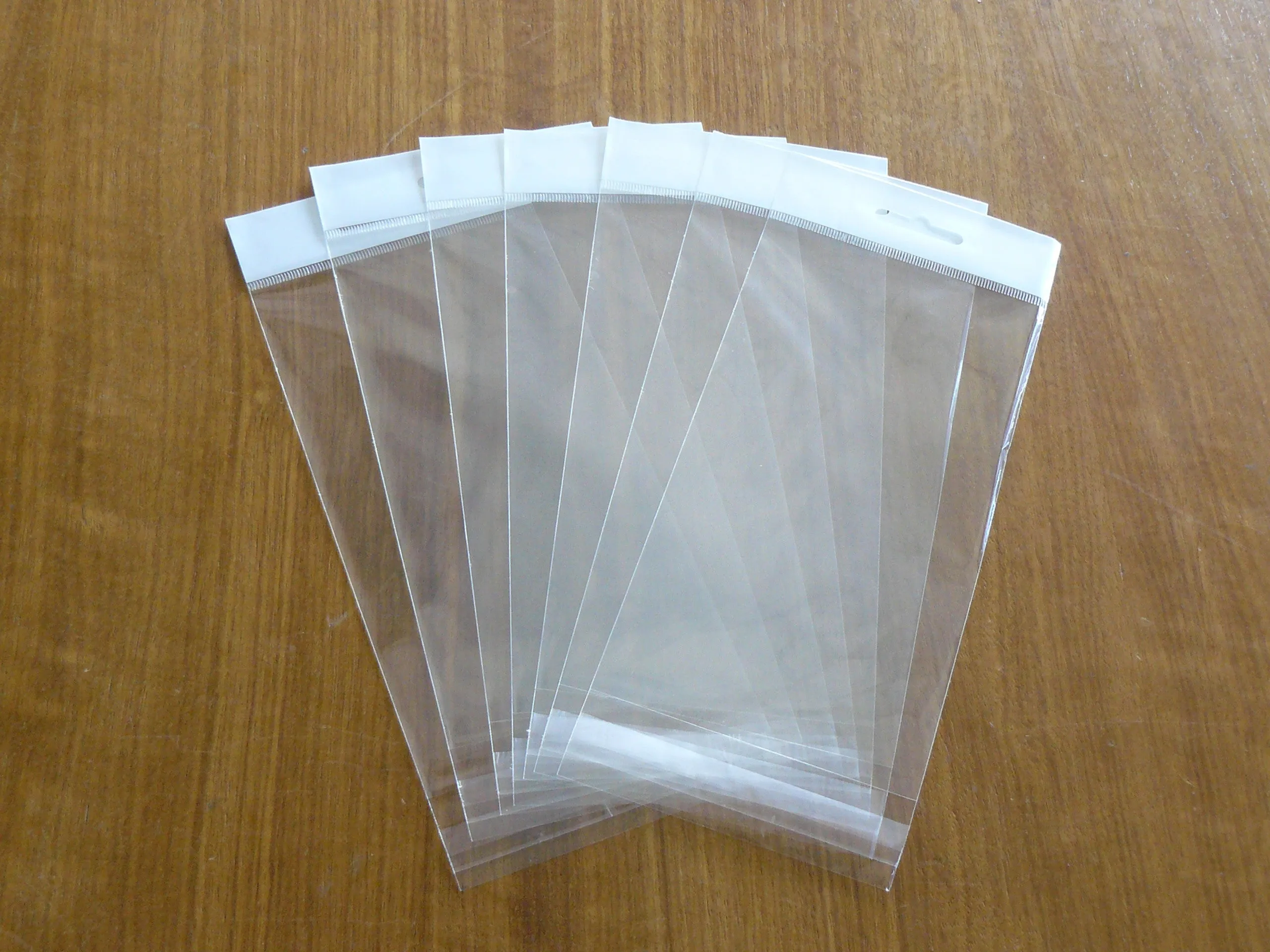 Self adhesive bag with Header and butterfly hole